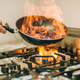 Kitchen safety tips to avoid injury, such as a burn from this hot skillet